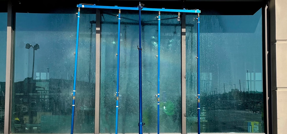 spray rack testing glass storefront for water intrusion
